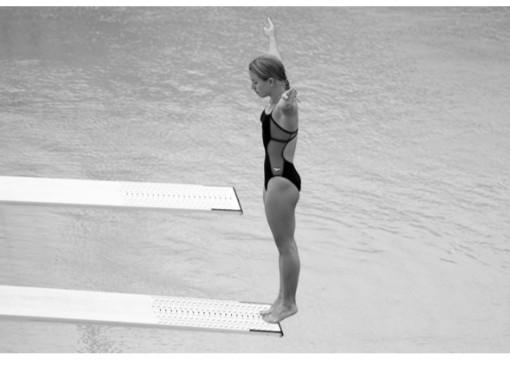 The Swimmer In The Figure Weighs 50 Kg And Hits The Board In A Vertical Position With A Speed Of 1 M S And She Stays Bou 1